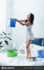 depositphotos_243167662-stock-photo-upset-woman-standing-bed-bucket.jpg